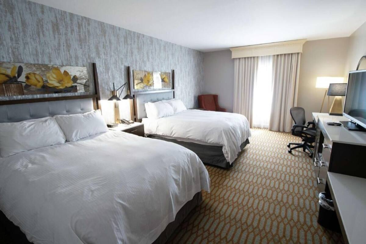 Hypo-allergenic bedding, down comforters, pillowtop beds, in-room safe