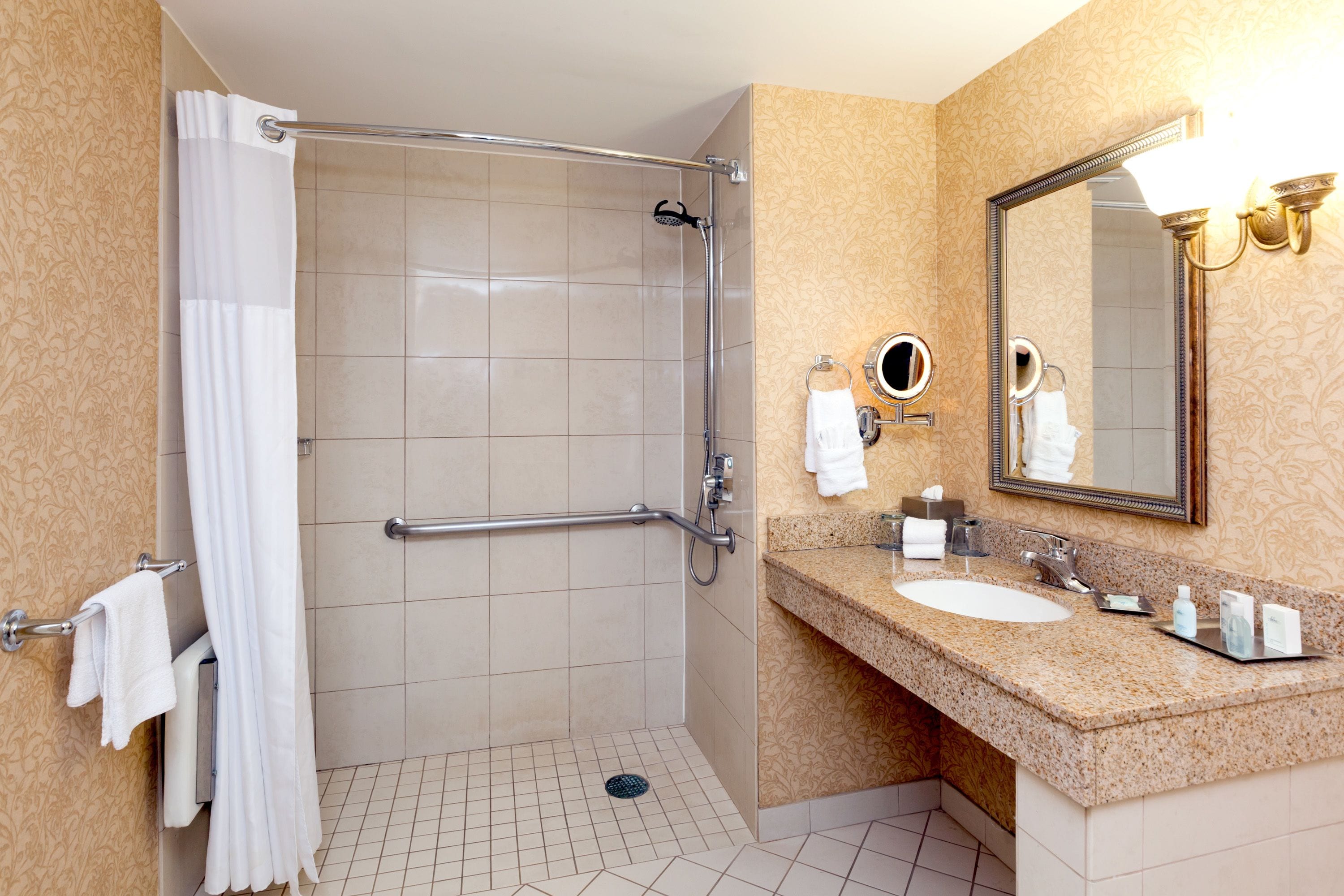 combined shower/bathtub, designer toiletries, hair dryer, towels
