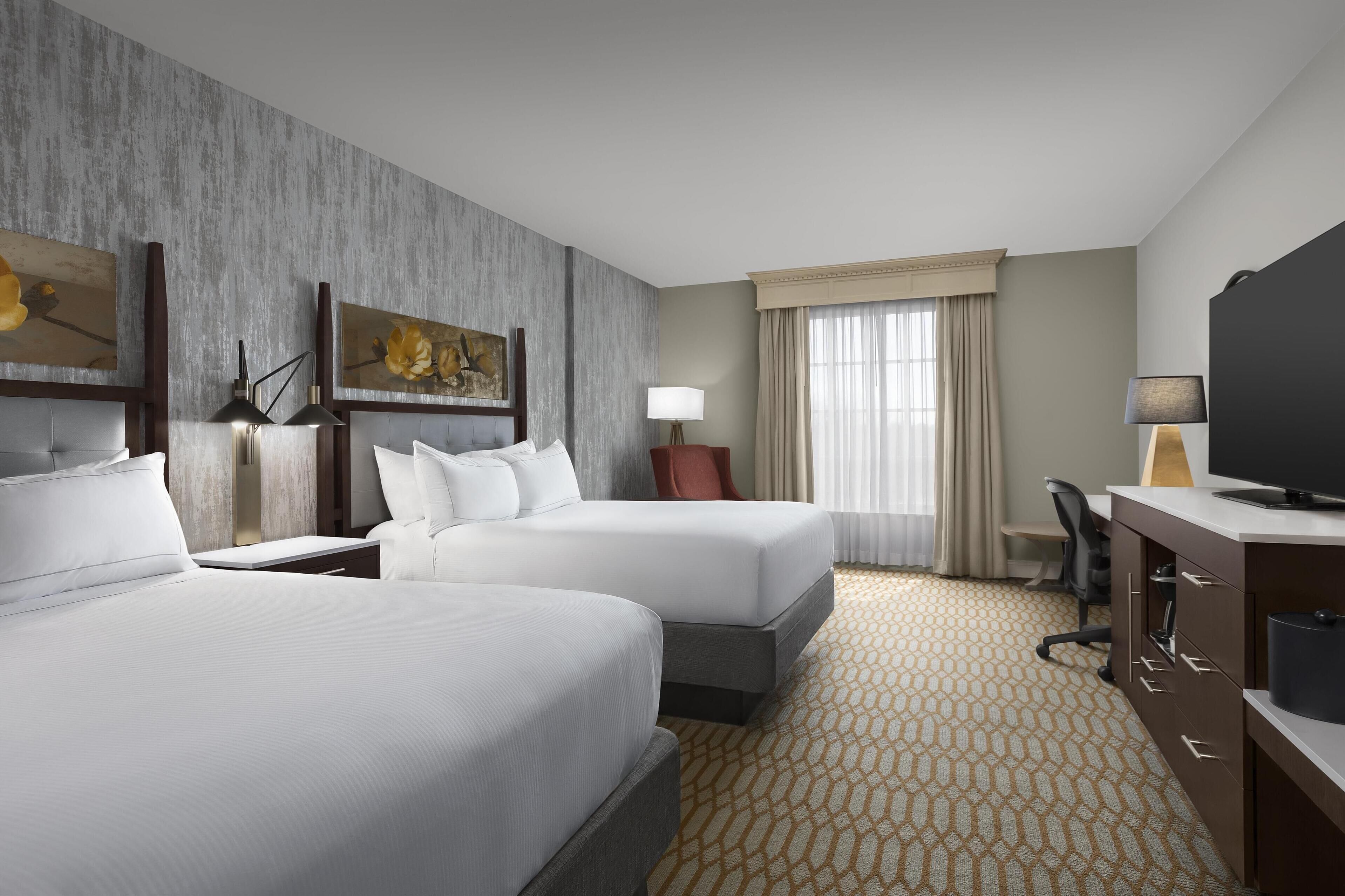 Hypo-allergenic bedding, down comforters, pillowtop beds, in-room safe