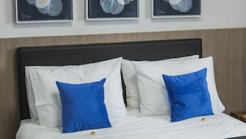 Premium bedding, down comforters, pillowtop beds, minibar