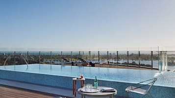 Outdoor pool, open 6 AM to 10 PM, sun loungers
