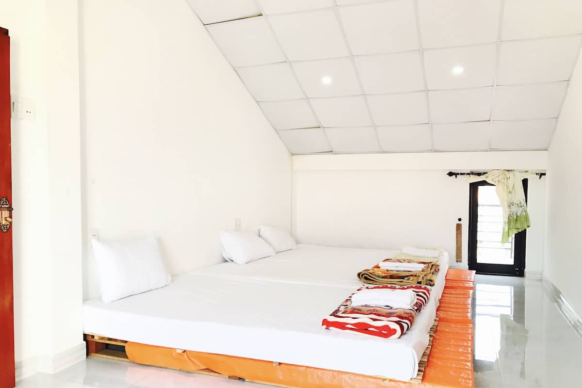 Triple Room (External Private Bathroom) | Minibar, in-room safe, desk, blackout curtains