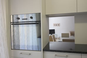 Apartment, 2 Bedrooms, Kitchen | Private kitchen | Fridge, microwave, stovetop, electric kettle - Swiss Star District 11 (Zürich)
