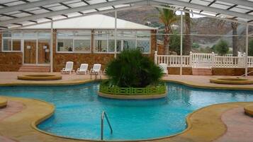 Seasonal outdoor pool, pool loungers