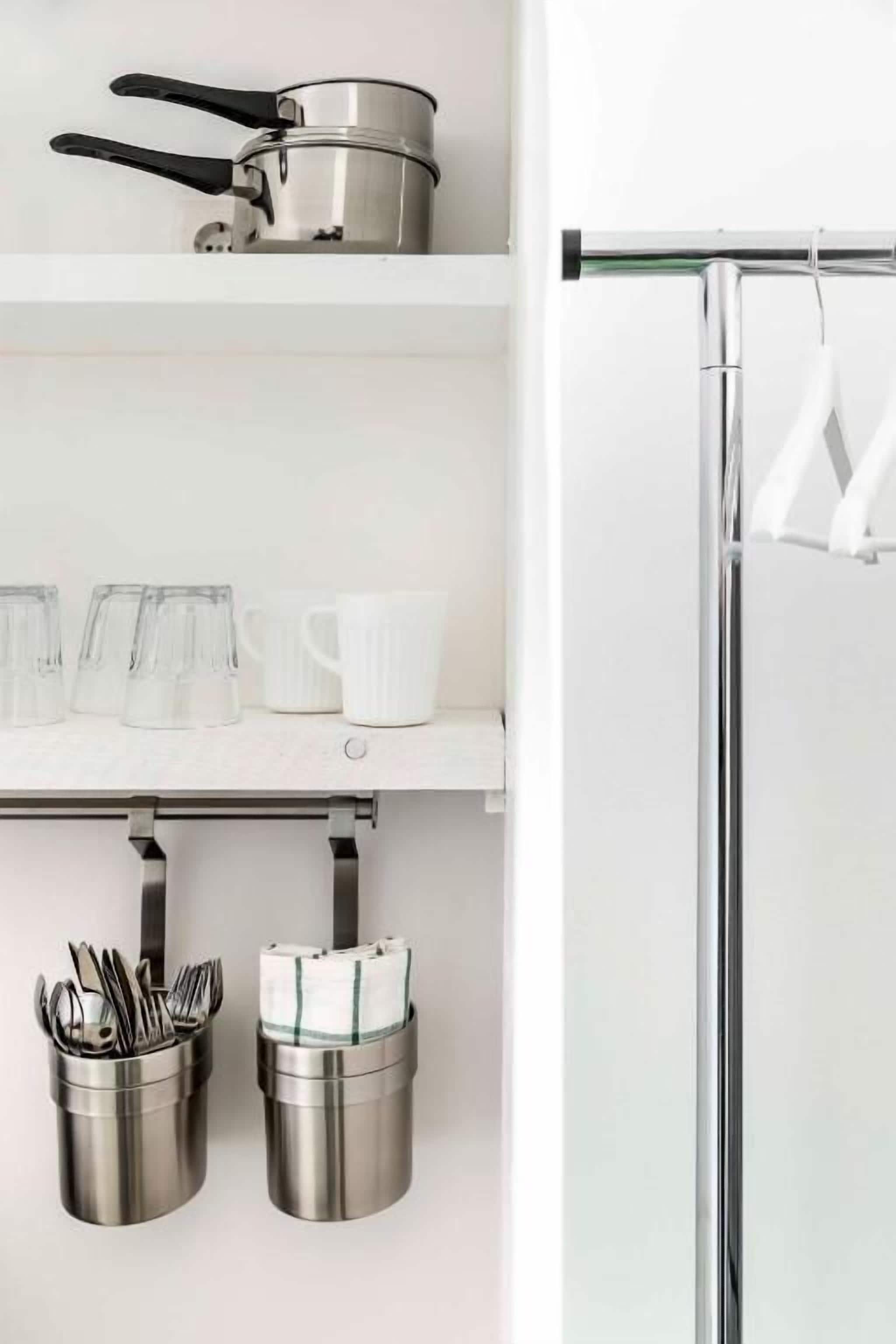 fridge, stovetop, electric kettle, cookware/dishes/utensils