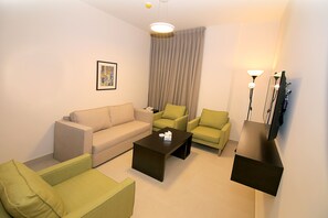 Family Suite | Living room | 40-inch LED TV with satellite channels, TV - Viola Hotel Suites (Amman)