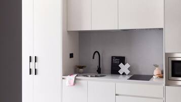 Fridge, electric kettle, cookware/dishes/utensils
