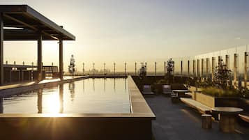 Outdoor pool, open 6:00 AM to 11:00 PM, sun loungers