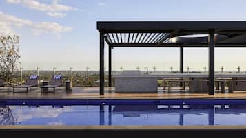 Outdoor pool, open 6:00 AM to 11:00 PM, pool loungers