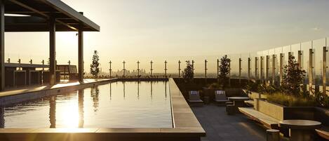 Outdoor pool, open 6:00 AM to 11:00 PM, sun loungers