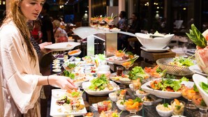 A buffet with various dishes and a person serving food. -  Regenta Arie Lagoon Negombo (Negombo)