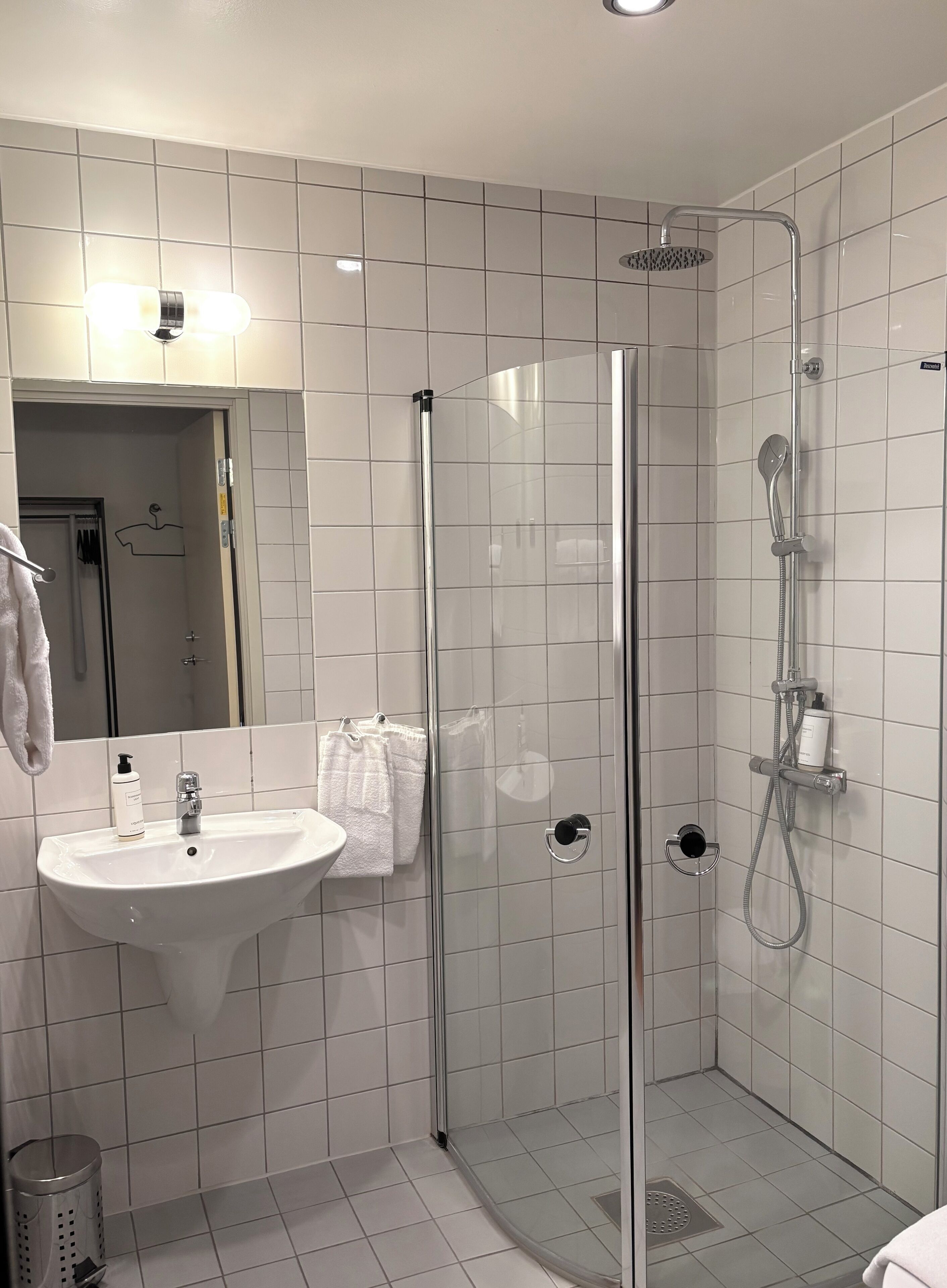 shower, designer toiletries, hair dryer, towels