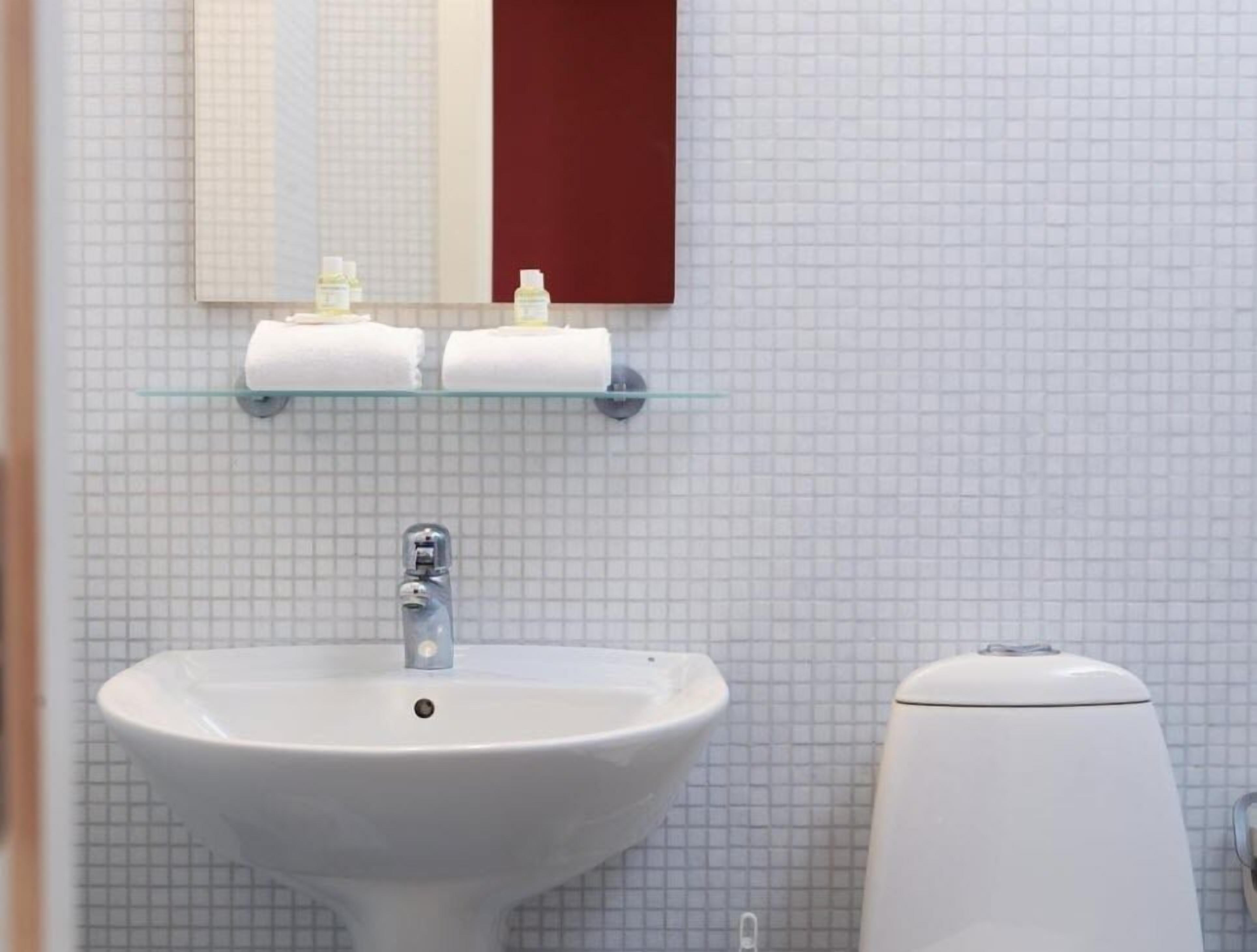 shower, designer toiletries, hair dryer, towels