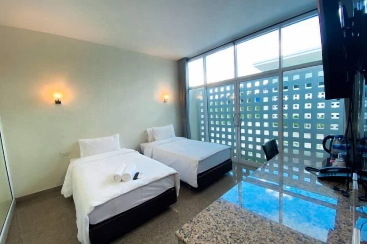 Desk, laptop workspace, free WiFi, bed sheets
