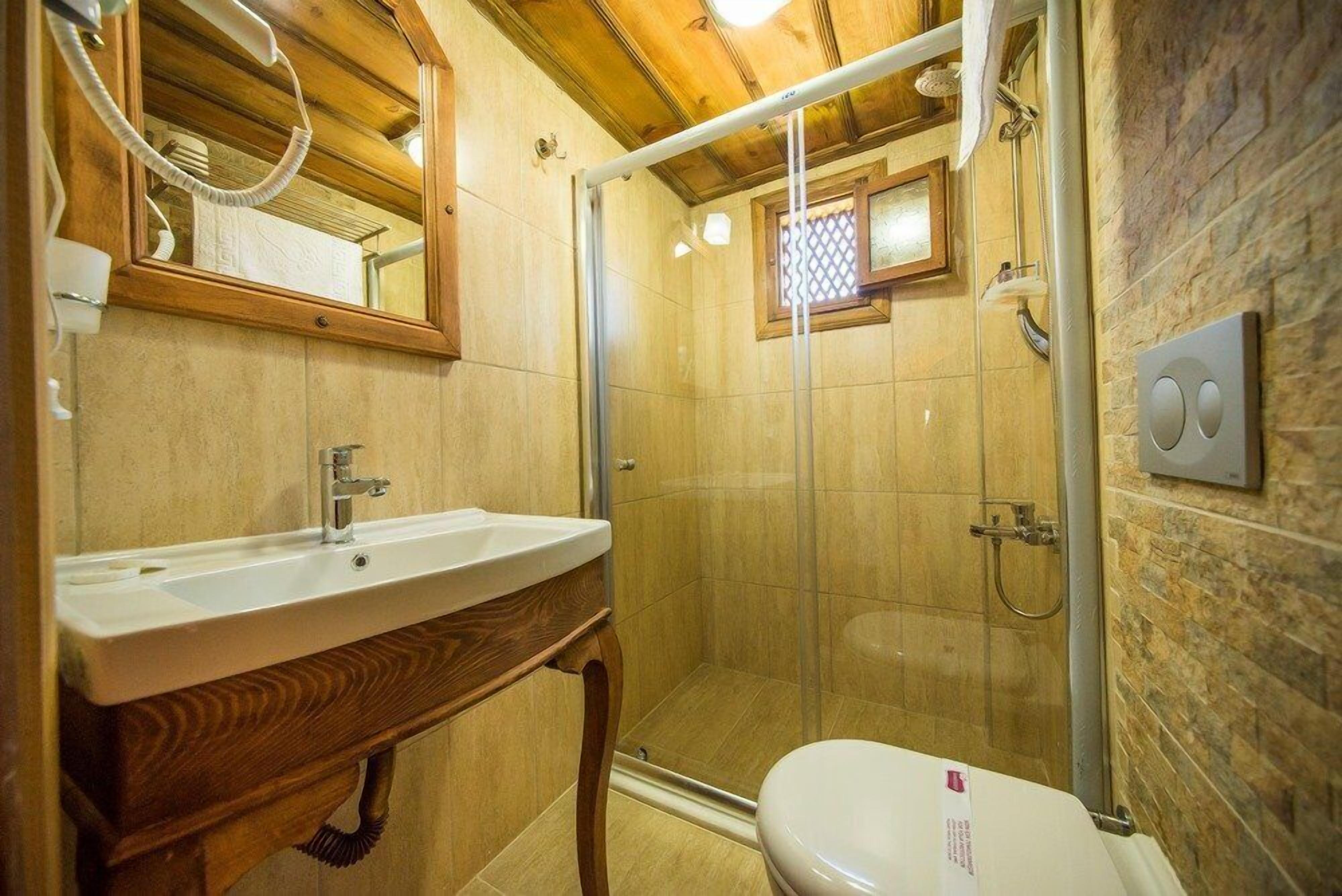 deluxe triple room | bathroom | shower, free toiletries, hair dryer, slippers