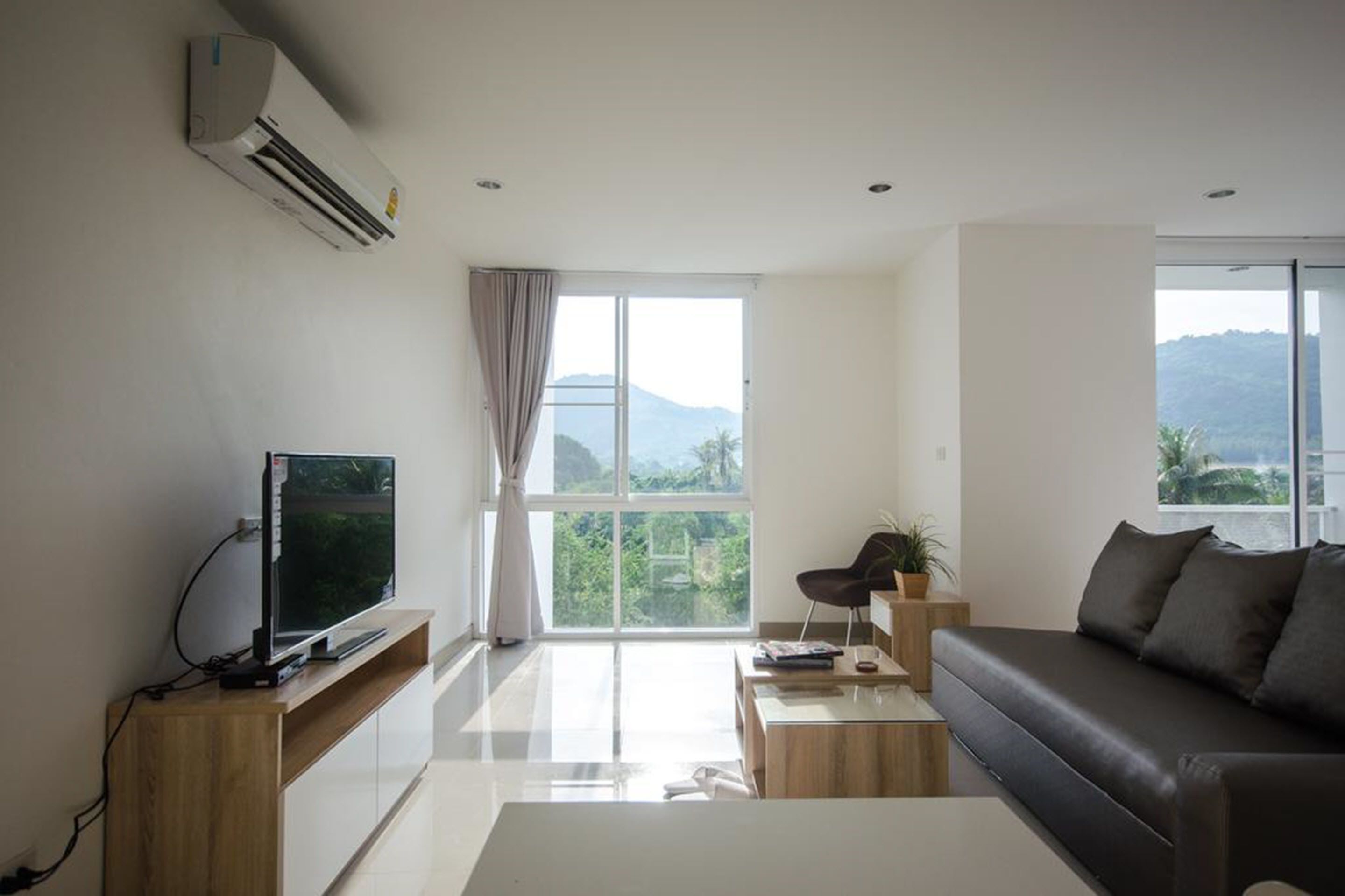 suite with mountain view  | living area | flat-screen tv