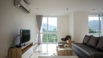 Suite with Mountain View | Living area | Flat-screen TV