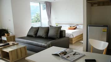 Suite with Mountain View | Living area | Flat-screen TV