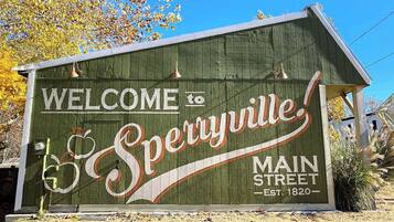 A wooden welcome sign for Spetynville Main Street, established in 1820.