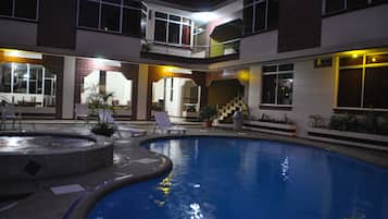 Outdoor pool, open 9:00 AM to 9:00 PM, pool loungers