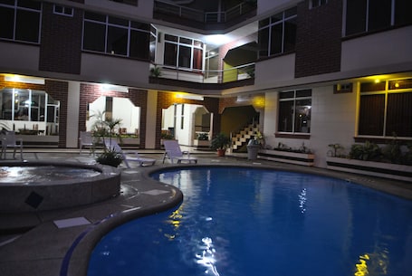 Outdoor pool, open 9:00 AM to 9:00 PM, pool loungers