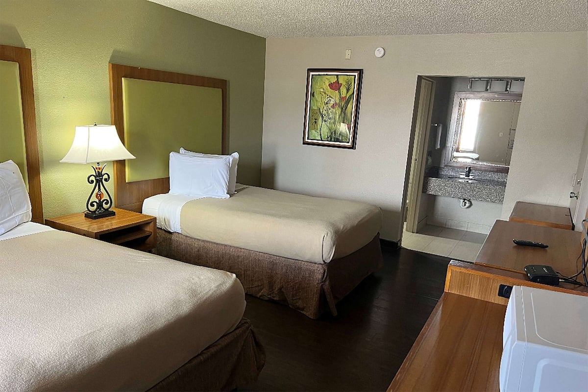 Premium bedding, pillowtop beds, desk, laptop workspace