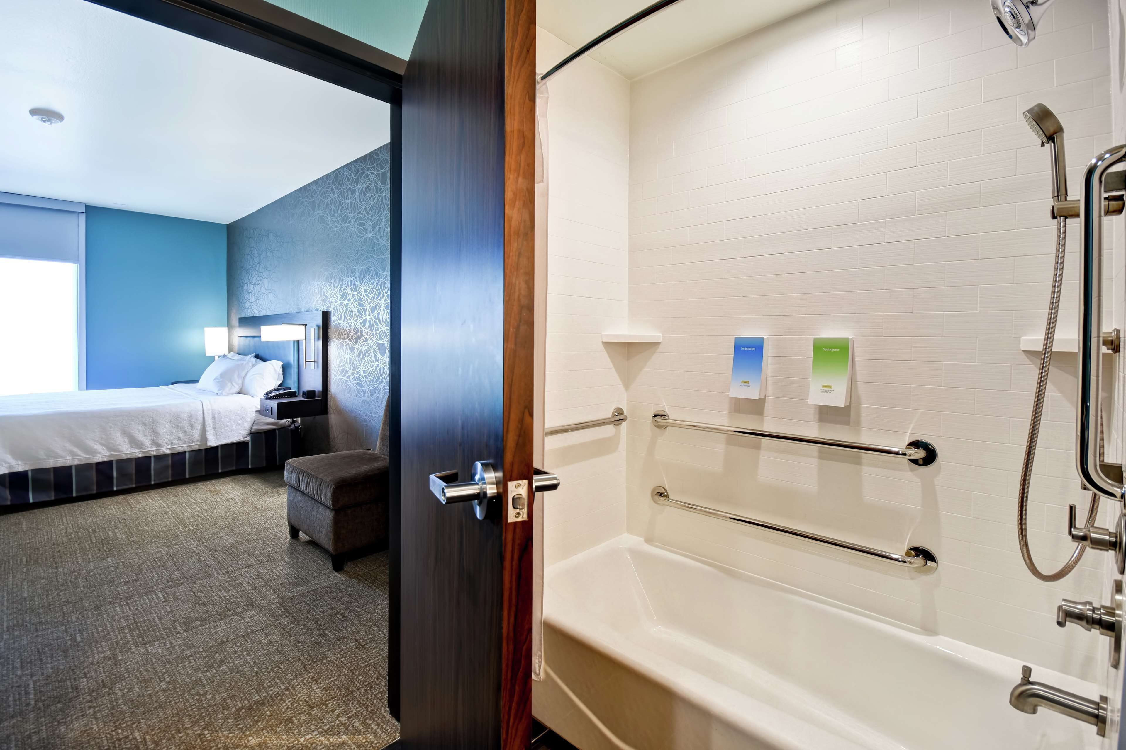 suite, 1 king bed, accessible, bathtub | bathroom | hair dryer, towels, soap, shampoo