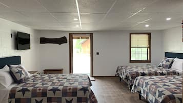 Deluxe Room, Multiple Beds, Refrigerator & Microwave | Living area | Smart TV