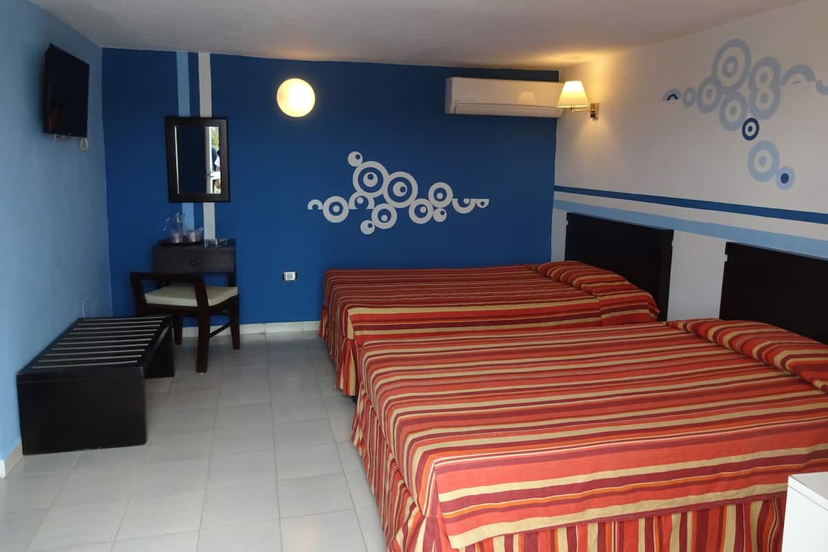 Standard dubbelrum | Minibar, mörkläggningsgardiner och sängkläder