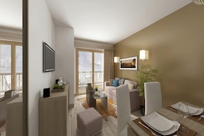 A modern living room with a sofa, coffee table, and a dining area with a table set for two.
