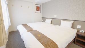 A hotel room with a large bed, a bedside table, a clock, and a framed picture on the wall. - Hotel Amabile Maizuru (Maizuru)