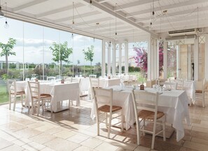 Breakfast, lunch, dinner served; Mediterranean cuisine, garden views