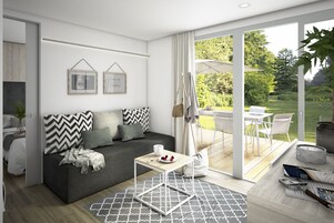 Cabana luxo, 2 quartos | Área de estar | TV