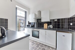 Family Apartment | Private kitchen | Fridge, microwave, oven, stovetop