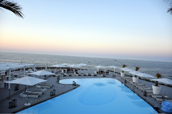 Seasonal outdoor pool, pool umbrellas, pool loungers