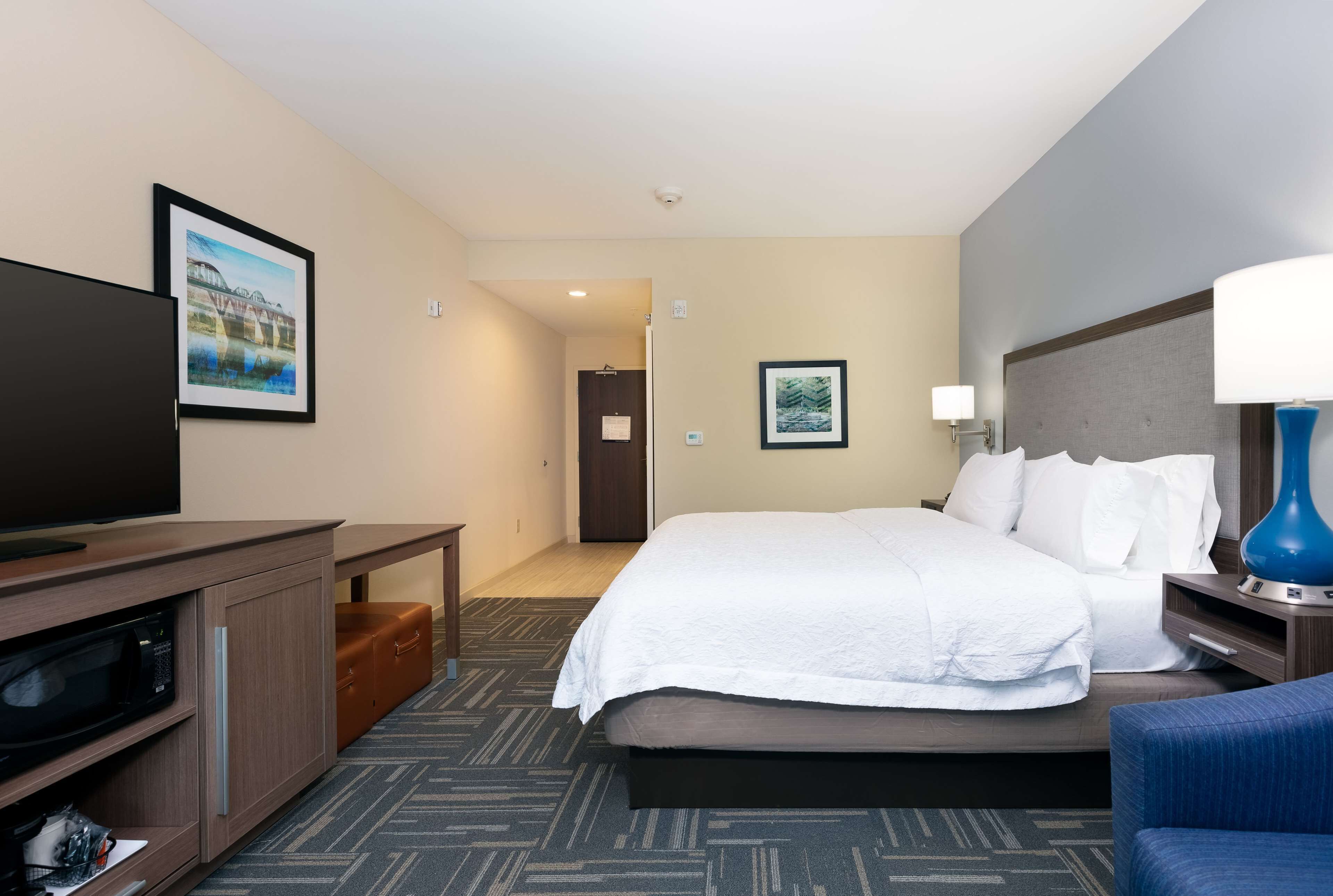 room, 2 queen beds, refrigerator & microwave | living area | flat-screen tv