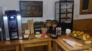 A kitchen counter with a coffee machine, a bread display, and various condiments. - Chalet 1200 (Saint-François-Longchamp)
