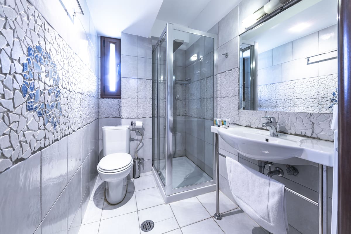 suite (terpsichori) | bathroom | shower, free toiletries, hair dryer, bathrobes