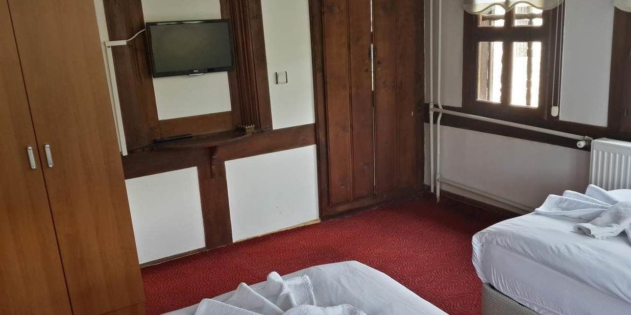 standard triple room | living area | lcd tv