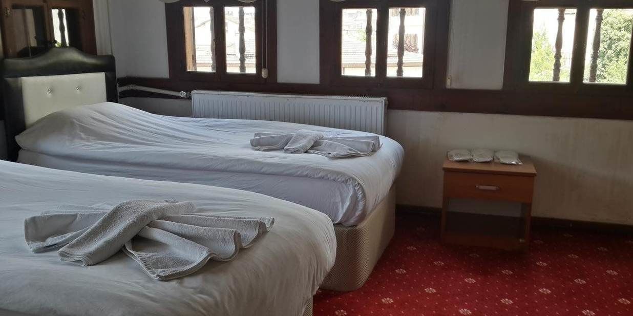 standard triple room | living area | lcd tv