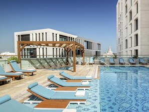 Outdoor pool, open 6:00 AM to 9:00 PM, pool umbrellas, pool loungers