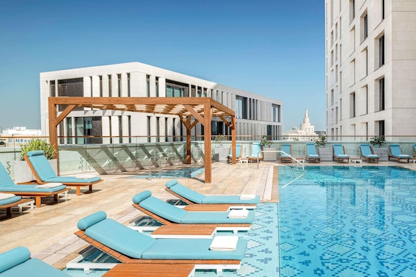 Outdoor pool, open 6:00 AM to 9:00 PM, pool umbrellas, pool loungers