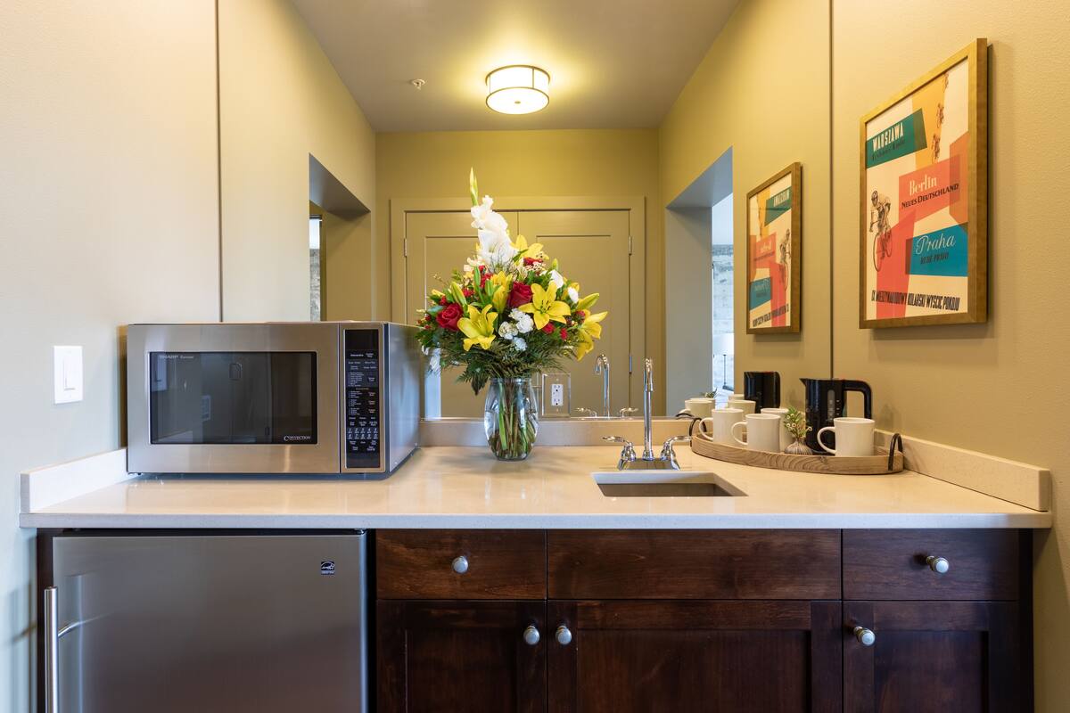 grand studio suite, 1 king bed with sofa bed, city view, corner | mini fridge