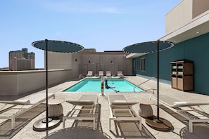 Outdoor pool, open 9:00 AM to 10:00 PM, pool loungers