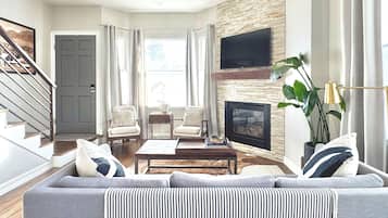 Smart TV, fireplace, books, music library