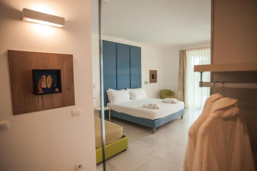 Junior Room, Pool View | In-room safe, desk, blackout drapes, iron/ironing board