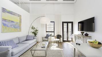 Apartment, 2 Bedrooms, Sea View | Living room | Flat-screen TV