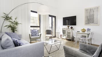 Apartment, 2 Bedrooms, Sea View | Living room | Flat-screen TV