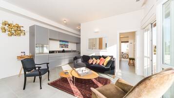 Apartment, 1 Bedroom | Living room | Flat-screen TV