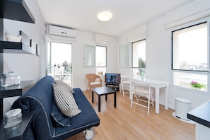 Apartment, 1 Bedroom | Living area | Flat-screen TV